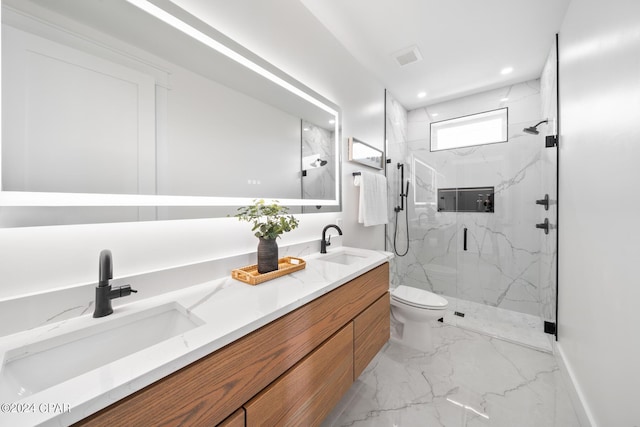 bathroom featuring vanity, toilet, and an enclosed shower