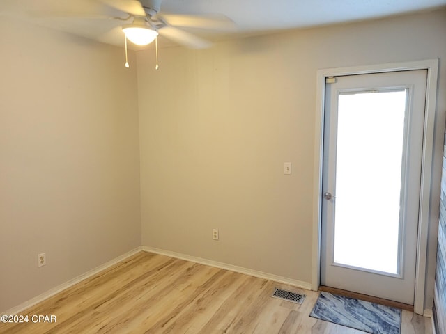 unfurnished room with ceiling fan and light hardwood / wood-style flooring