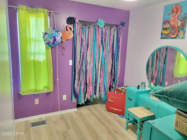 bedroom featuring hardwood / wood-style flooring