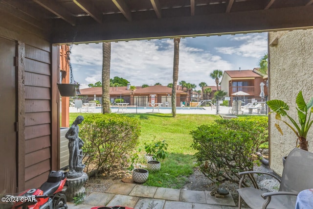 view of yard featuring a community pool