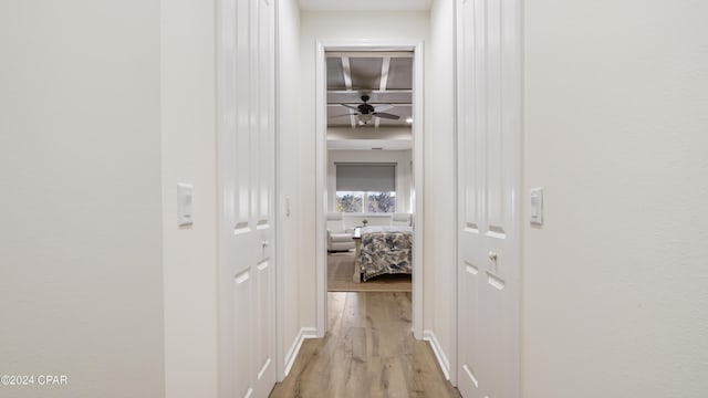 corridor with light wood-type flooring