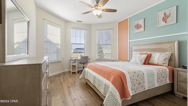 bedroom featuring ceiling fan and light hardwood / wood-style flooring