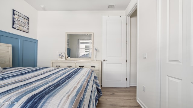 bedroom featuring a closet and light wood-type flooring