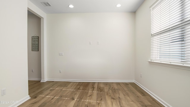 spare room featuring hardwood / wood-style flooring