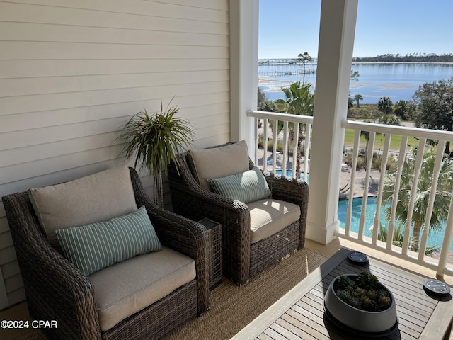 balcony featuring a water view