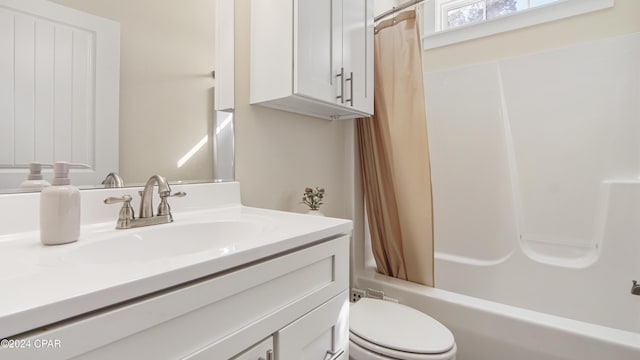 full bathroom featuring vanity, shower / bath combination with curtain, and toilet