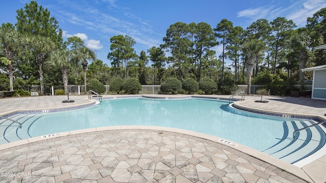 view of pool featuring a patio area