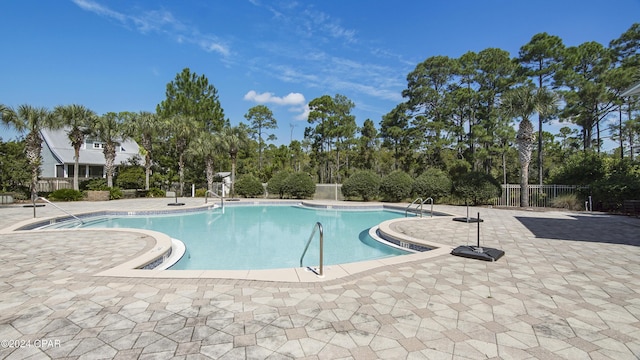 view of swimming pool with a patio area