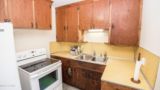 kitchen with white appliances and sink