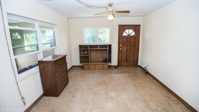 entryway with ceiling fan and light wood-type flooring