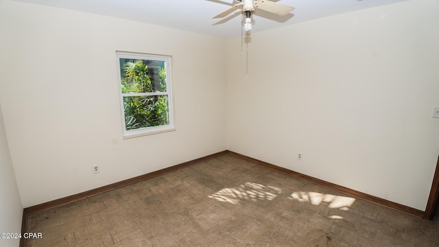 spare room with ceiling fan