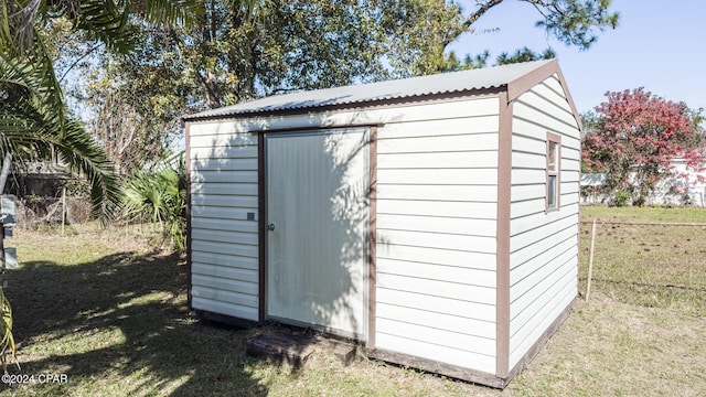 view of outdoor structure with a yard