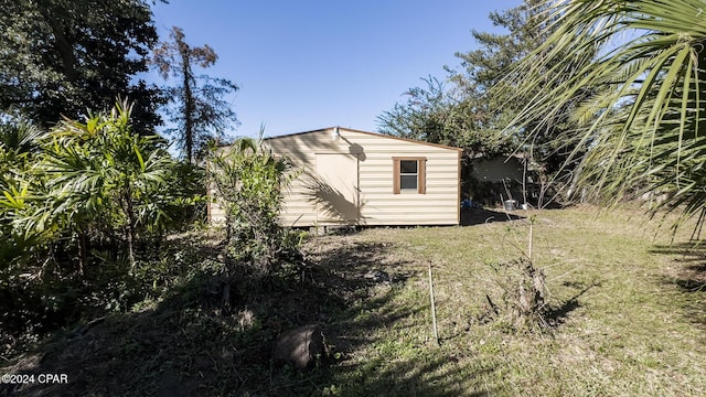 view of home's exterior featuring a shed