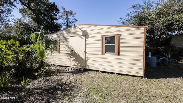 view of side of property with a shed