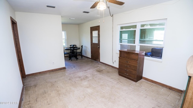 interior space featuring ceiling fan and a healthy amount of sunlight