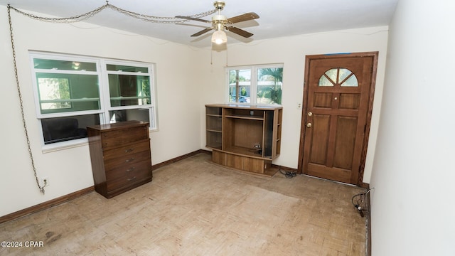 foyer entrance featuring light wood-type flooring and ceiling fan