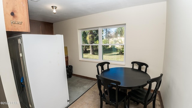 dining room with light parquet flooring