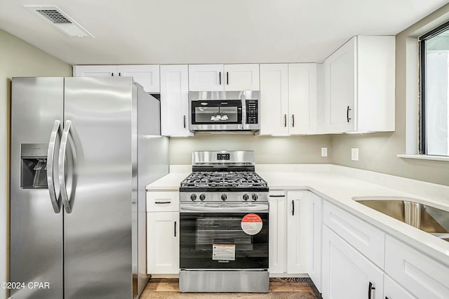 kitchen featuring white cabinets and stainless steel appliances