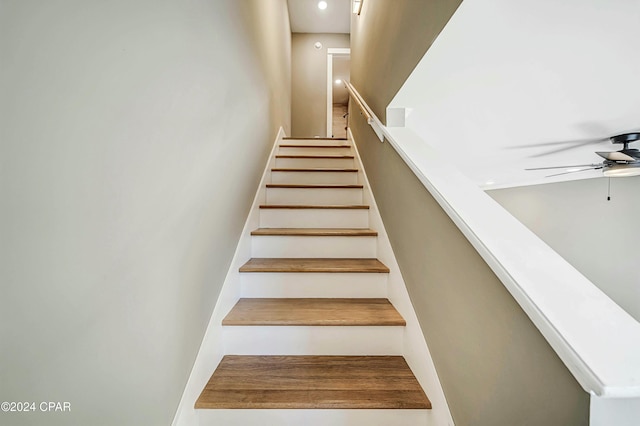 stairway with ceiling fan