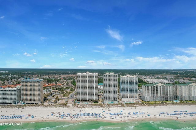 bird's eye view with a water view and a beach view