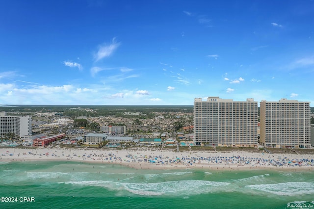 aerial view with a water view and a beach view