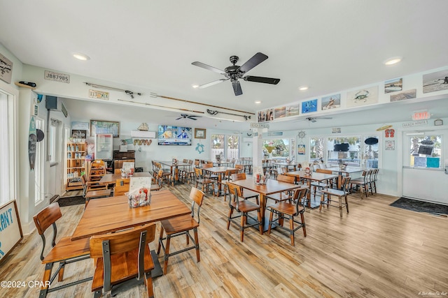 dining space with ceiling fan and light hardwood / wood-style floors