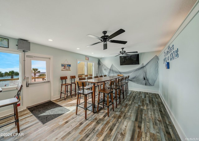 dining room with ceiling fan and dark hardwood / wood-style floors