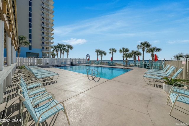 view of swimming pool with a patio area