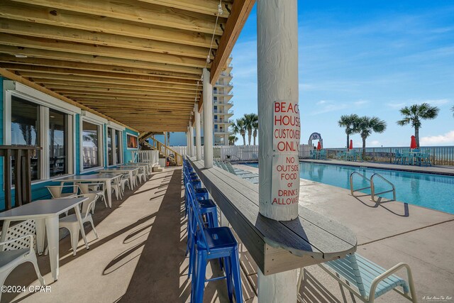 view of swimming pool featuring a patio area