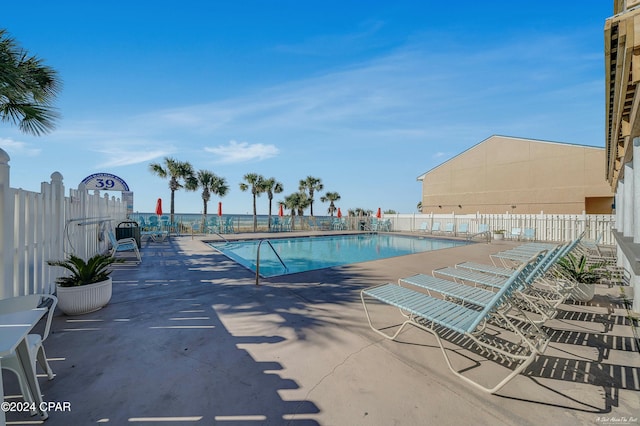 view of swimming pool with a patio area