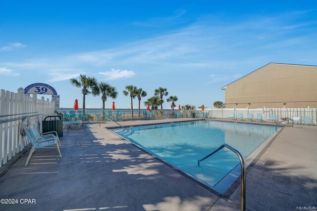 view of swimming pool with a patio