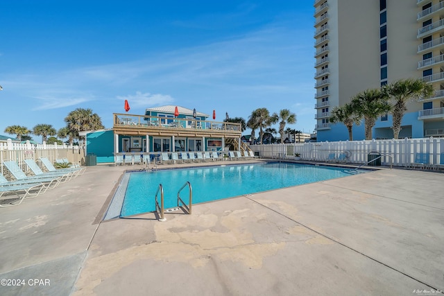 view of swimming pool with a patio