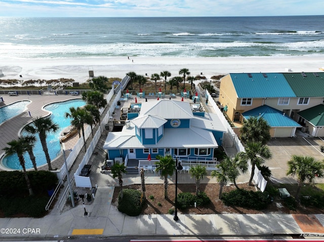 aerial view featuring a water view and a view of the beach