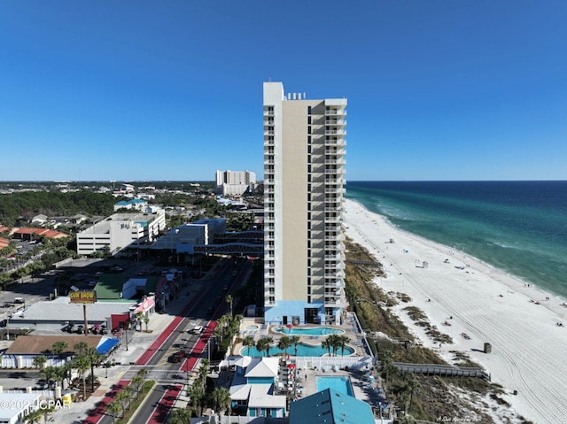 birds eye view of property with a view of the beach and a water view