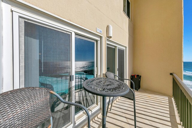 balcony featuring a water view