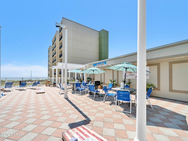 view of patio / terrace featuring fence