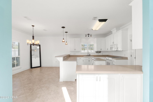 kitchen featuring white cabinets, white appliances, kitchen peninsula, and an inviting chandelier