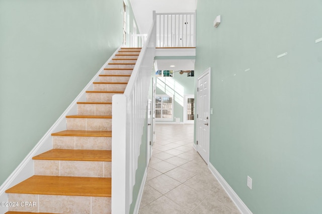 staircase with tile patterned floors