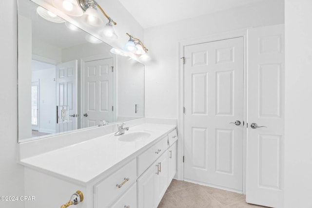 bathroom featuring tile patterned flooring and vanity