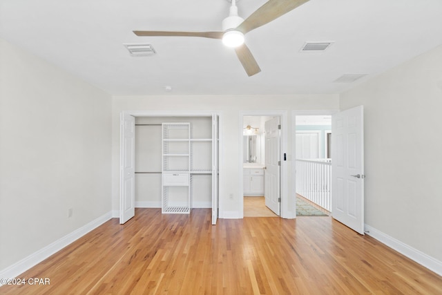 unfurnished bedroom with ensuite bath, ceiling fan, a closet, and light hardwood / wood-style floors