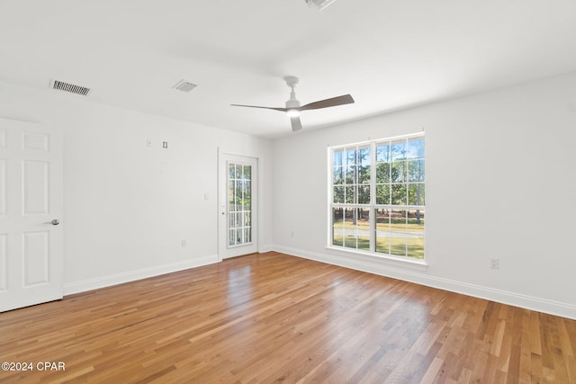 spare room featuring hardwood / wood-style flooring and ceiling fan