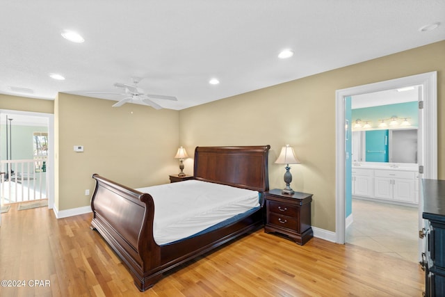 bedroom featuring access to exterior, ensuite bathroom, light hardwood / wood-style flooring, and ceiling fan