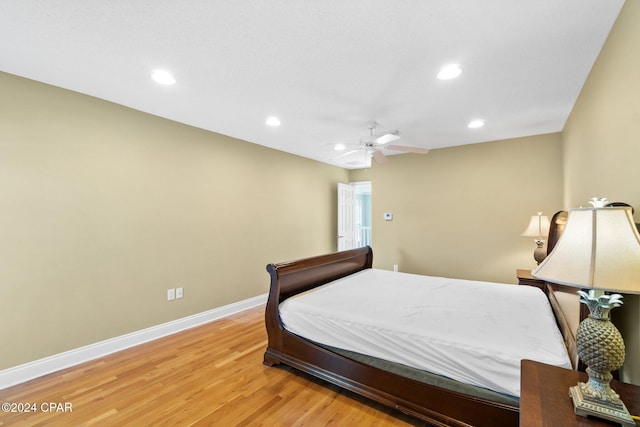 bedroom with wood-type flooring and ceiling fan