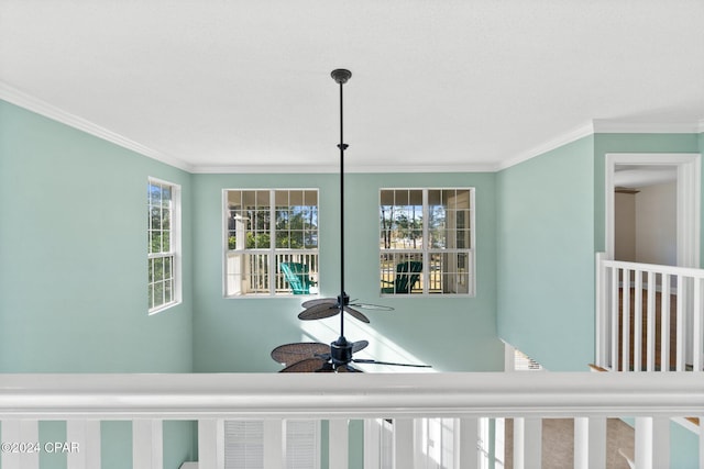 interior details with ceiling fan and crown molding