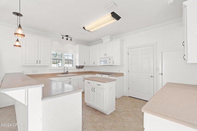 kitchen with white cabinetry, sink, white appliances, and ornamental molding