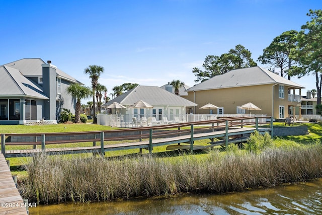 surrounding community with a water view