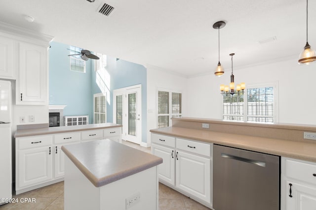 kitchen with white cabinetry, a center island, hanging light fixtures, stainless steel dishwasher, and ceiling fan with notable chandelier