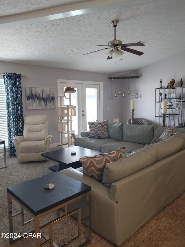 living room with carpet flooring, french doors, a textured ceiling, and ceiling fan