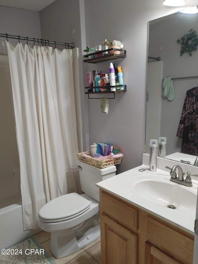 full bathroom featuring tile patterned flooring, vanity, toilet, and shower / tub combo with curtain