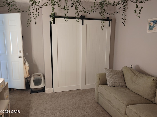 3707 Bay Tree Rd, Lynn Haven, FL 32444 - carpeted living room with a barn door and baseboards